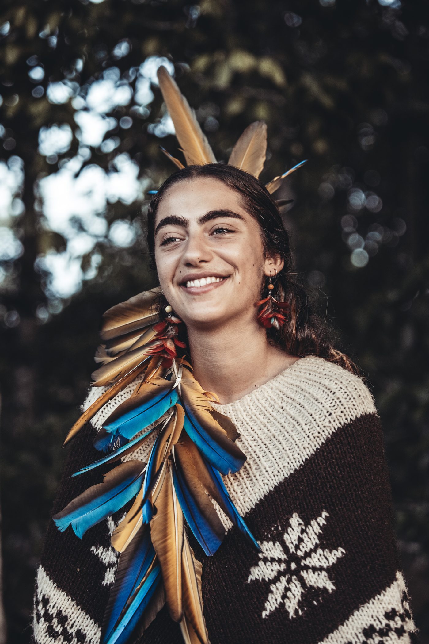 A participant in feathered headdress in Acre, Brazil